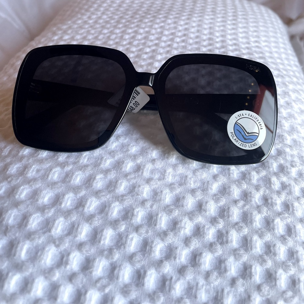 Stella BLACK oversized polarized sunglasses by the brand iSEA! From free people